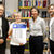 Eröffnung vor dem Regal in der Bibliothek Gruna mit 2 Frauen (M. Kunis-Michel, U. Just) und Männern (R. Rabe und C. Barth)